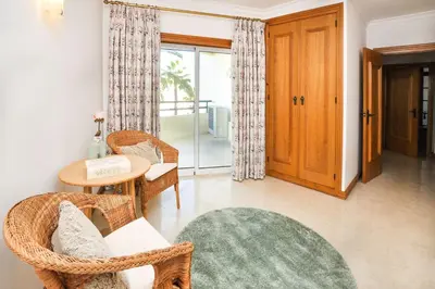 a bedroom with two beds with blue pillows at Galé Mar by OCvillas in Galé