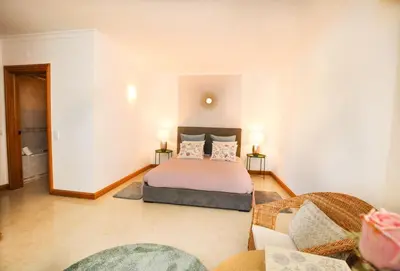 a bedroom with a bed and a living room at Galé Mar by OCvillas in Galé