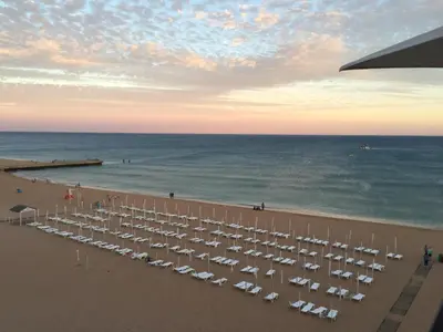 a beach with a lot of chairs and the ocean at CASA 4 - Perfect location - Sea view by DreamvillasAlbufeira in Albufeira