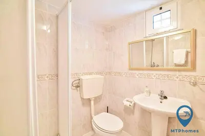 a bathroom with a toilet and a sink at Vila Portuguesa by MTPhomes in Albufeira