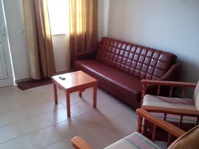 a living room with a couch and a coffee table at Albufeira 2 bedroom apartment 5 min from Falesia beach and close to center I in Albufeira