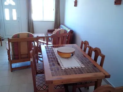 a wooden table with a bowl on top of it at Albufeira 2 bedroom apartment 5 min from Falesia beach and close to center I in Albufeira