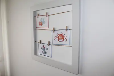 a white door with four pictures on the wall at Apartamento Oura - BlueSea in Albufeira