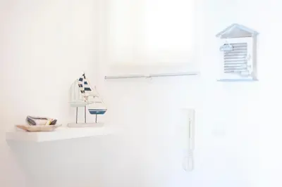 a white bathroom with a sink and a mirror at Santa Eulália Apartment Luxury - Blue Sea in Albufeira