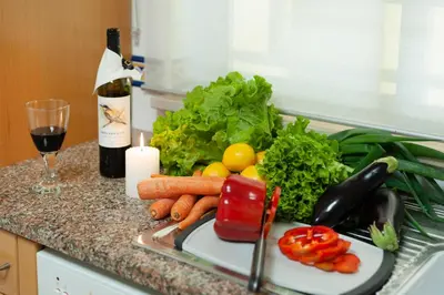 a bunch of vegetables on a counter next to a sink at Santa Eulália Apartment Luxury - Blue Sea in Albufeira