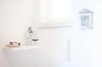 a white kitchen with a sink and a shelf at Santa Eulália Apartment Luxury - Blue Sea in Albufeira