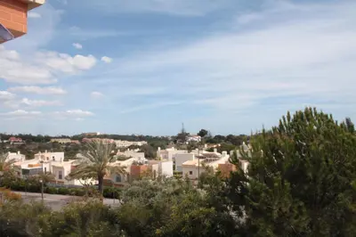 a view of a city with trees and buildings at Apartamento com Piscina em Albufeira, Corcovada in Albufeira