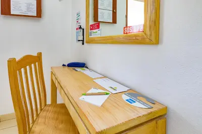 a wooden table with a mirror on a wall at Natura Algarve Club in Albufeira