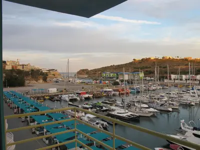a marina filled with lots of boats in the water at AMM SeaView Marina Albufeira apartment in Albufeira