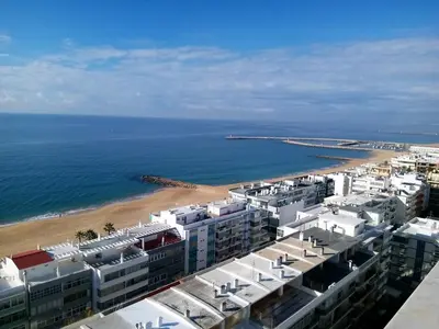 an aerial view of a beach with buildings and the ocean at ABMAR- Por-do-sol, Vista mar, Remodelado, Wifi, 80mt Praia in Quarteira