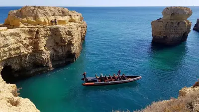 a group of people on a boat in the water at Magnific Studio with a cozy garden, 5 minutes to the beach in Albufeira