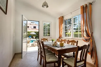 a balcony with white railing and a view of the city at A Fantastic Place for Families, Hilton Hotel are and close to amenities in Quarteira