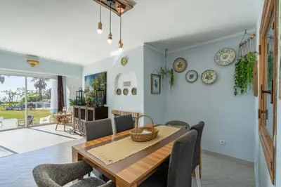 a bedroom with a bed and a large window at Bem Parece by Umbral in Albufeira