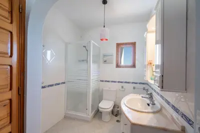 a bathroom with a shower and a toilet and a sink at Bem Parece by Umbral in Albufeira