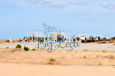 a sign for a playground on the beach at Irene's Place in Quarteira