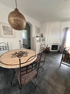 a dining room with a table and chairs at Apartamentos Sao Rafael, 80b in Albufeira