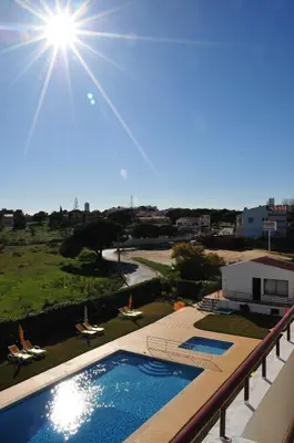 a view of a swimming pool on a balcony at Solgarve in Quarteira