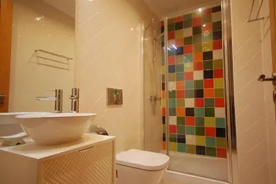 a bathroom with a shower and a toilet and a sink at São Rafael Beach 300 m - Vila Rosal house in Albufeira