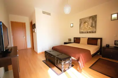 a bedroom with a bed and a television in it at São Rafael Beach 300 m - Vila Rosal house in Albufeira
