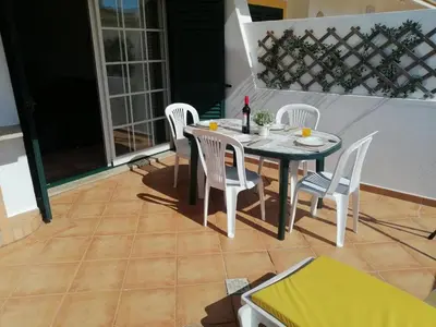 a bathroom with a sink and a tv on a balcony at Beautiful Vila Rafaella, walk distance to beaches in Albufeira