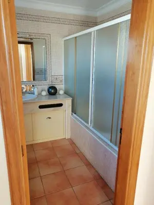 a bathroom with a toilet and a sink and a shower at Beautiful Vila Rafaella, walk distance to beaches in Albufeira