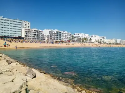 a view of a beach with buildings in the background at Atlantico 8- Vista Mar, Ar-Condicionado, 80mt Praia, Wifi in Quarteira