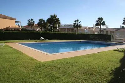 a swimming pool in the middle of a yard at 4 bedroom town house Vale de Parra, close to Gale AT22 in Guia