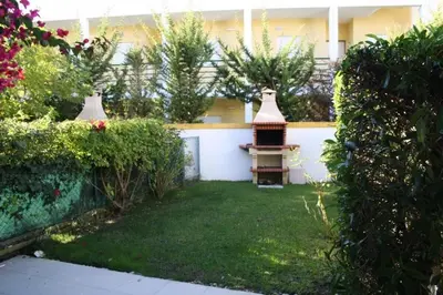 a house with a yard with a bird house at 4 bedroom town house Vale de Parra, close to Gale AT22 in Guia