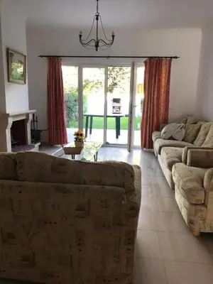 a living room with a couch and a fireplace at 4 bedroom town house Vale de Parra, close to Gale AT22 in Guia