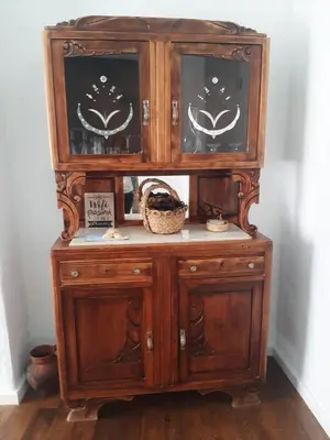 a wooden hutch with two doors on top of it at Traditional House in Historical Center of Faro in Faro