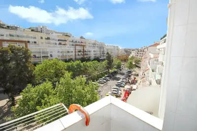 a view from a balcony of a city street at Comfortable studio in Albufeira - 20 m² - Pleasant balcony in Albufeira