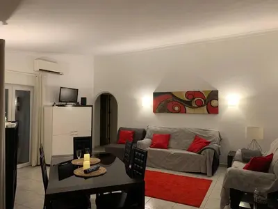a living room with a couch and a table at A CASINHA - Pateo Aldeia in Albufeira