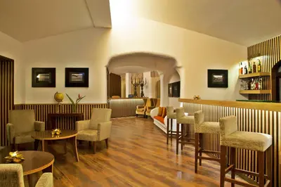 a waiting room with chairs and a bar at Sao Rafael Holidays in Albufeira