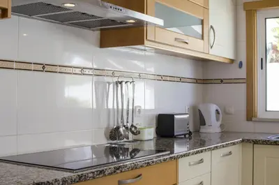 a kitchen with a sink and a counter top at Villa Maresia in Galé