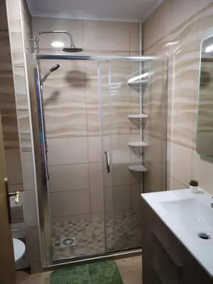 a bathroom with a shower and a sink at Lux Home in Albufeira