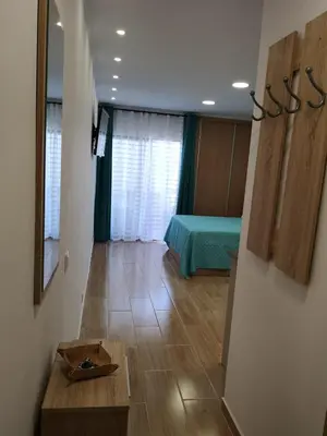 a room with a room with a bed and a table at Lux Home in Albufeira
