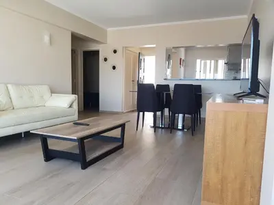 a living room with a couch and a table at Vista Mar e Terra in Albufeira