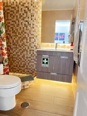 a bathroom with a toilet and a sink at Vista Mar e Terra in Albufeira