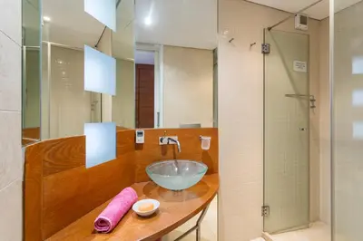 a bathroom with a bowl sink and a shower at Romy in Vale do Lobo