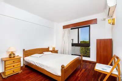 a bedroom with a bed and a window at WHome | Vilamoura Sunny Apartment in Quarteira
