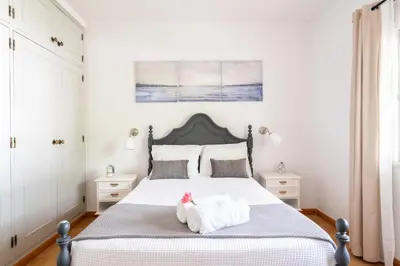 a bedroom with a bed with towels on it at Monte Madalena in Adega