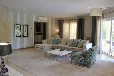 a living room with a couch and a table at VILLA SIBLING 2 in Vilamoura