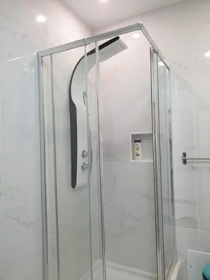 a shower with a glass door in a bathroom at AAA Apartments in Albufeira