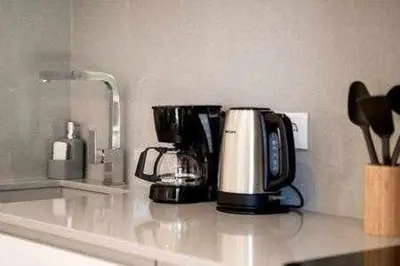 a coffee maker sitting on a kitchen counter at Vilamoura new style apt piscina wifi in Vilamoura