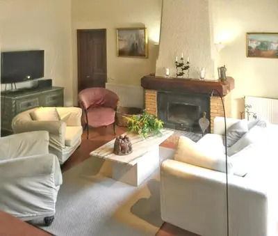 a living room with white furniture and a fireplace at Elegant Villa in Vilamoura with Private Pool in Vilamoura