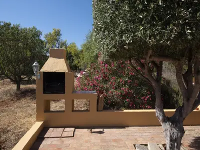 a bathroom with a bath tub and a sink at Delightful, authentic Quinta with pool in Loulé