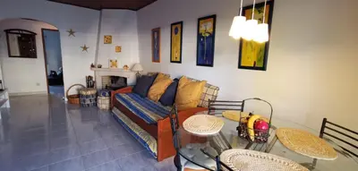 a living room with a couch and a table at Vilamoura T1 com piscina - Mouramar I in Vilamoura