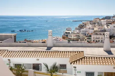 a view of the ocean from the roof of a building at Apartamentos Mónaco by Garvetur in Albufeira