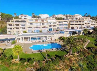 an aerial view of a large building with a swimming pool at CASA OKSANA in Albufeira