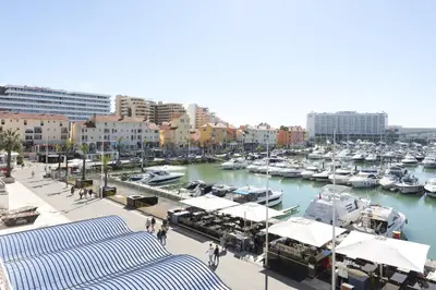 a marina with boats in the water and buildings at Marina Club - Sea front - Vilamoura in Vilamoura